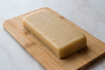 Homemade Almond Paste Whole Marzipan on Wooden Board.