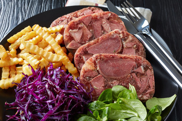 close-up of sliced beef tongue spicy aspic