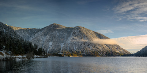 mountains in sunrise light early morning at alpine laake plansee