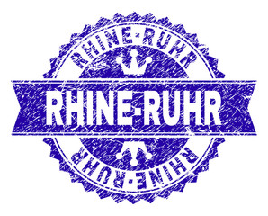 RHINE-RUHR rosette stamp seal watermark with distress style. Designed with round rosette, ribbon and small crowns. Blue vector rubber watermark of RHINE-RUHR title with unclean style.