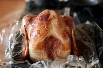 Freshly baked turkey resting on the stove top.