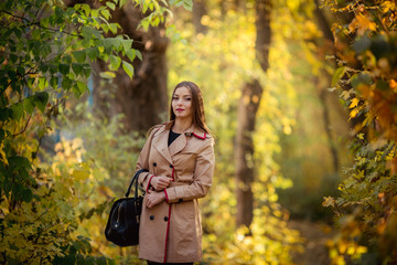 Beautiful girl in autumn garden