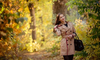 Beautiful girl in autumn garden