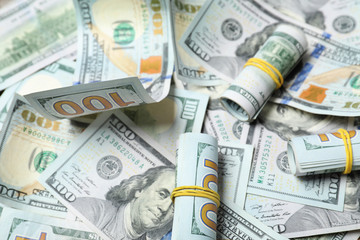 Fototapeta premium Many dollar banknotes as background. National American currency