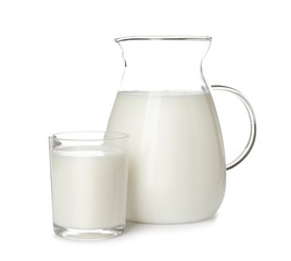 Glass and jug of fresh milk isolated on white