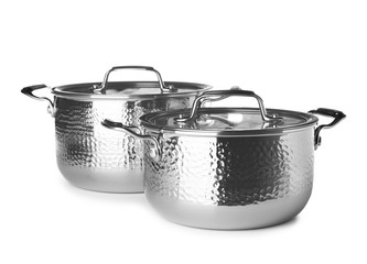 Modern metallic clean saucepans isolated on white