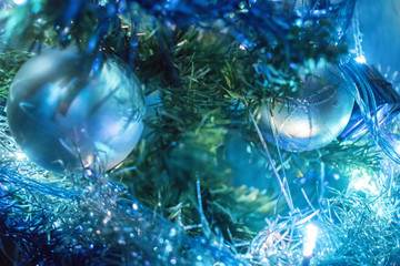 Christmas tree with blue ornaments.Christmas ball on the branches fir - 240799432