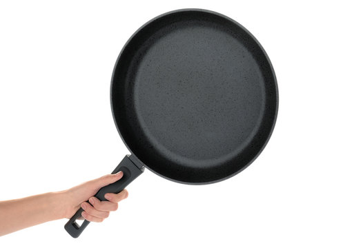 Woman holding modern clean frying pan isolated on white, closeup