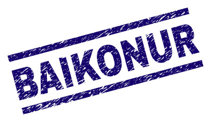 BAIKONUR seal print with distress style. Blue vector rubber print of BAIKONUR caption with retro texture. Text caption is placed between parallel lines.