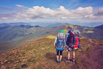 Couple of tourists are standing at the top