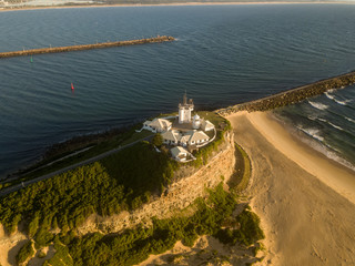 Aerial Photos of Nobby's Beach and Nobby's Lighthouse at Newcastle, New South Wales in Australia