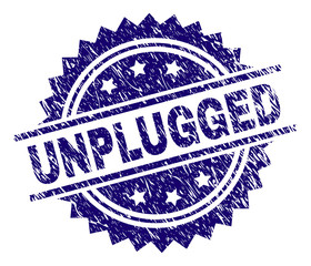 UNPLUGGED stamp seal watermark with distress style. Blue vector rubber print of UNPLUGGED title with grunge texture.