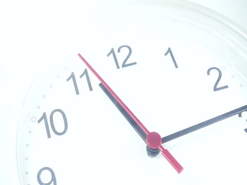Close up White clock face 4k stock footage, with numbers and a ticking arrow, Time concept, Time lapse moving fast.