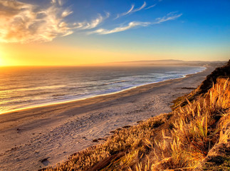 Sunset Along Coastline with Grass