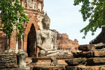 Fototapeta premium Ayutthaya Historic Park, Thailand - Buddha Statue at Ancient Ruins,