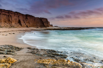 Cliffs by the Ocean at Dusk