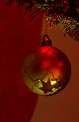 christmas ball with shaded star on red background