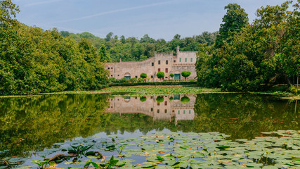 Castello del Catajo, a Venetian patrician house, and its reflectiton in the pond of its garden, near Padua, Italy