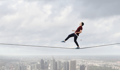 Brave ropewalker on cable. Mixed media