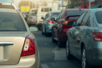 Fototapeta premium Gold car on the road in traffic junction there are many cars on the road.