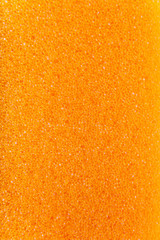 Orange background texture of the foam. Orange foam.