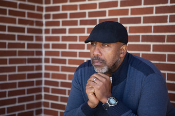 Mature African American man in deep thought.