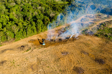 Aerial view of deforestation.  Rainforest being removed to make way for palm oil and rubber...