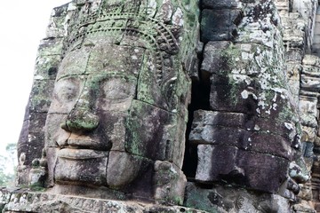smiling stone face on tower at Bayon castle