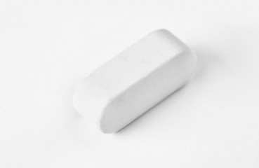 Pill on white background. Medical care and treatment