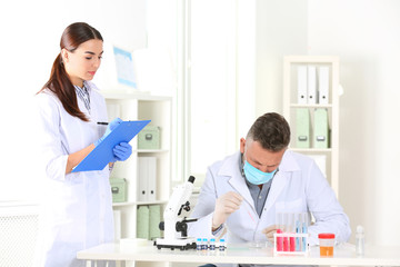 Scientists working in laboratory. Research and analysis