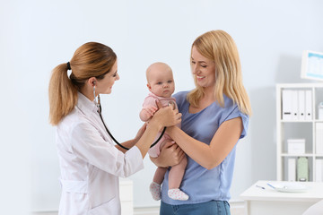 Woman with her baby visiting children's doctor in hospital