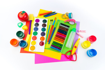 School accessories are laid out in the form of a rainbow. white background.