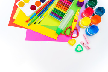 School accessories are laid out in the form of a rainbow. white background. Copy space.