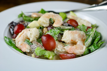 A Waldorf salad with shrimp.