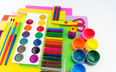 School accessories are laid out in the form of a rainbow. white background.
