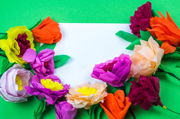 tools making crepe paper flowers green background