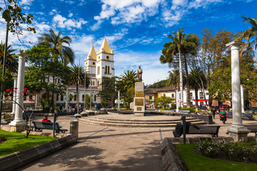 Fototapeta na wymiar Libertador Simón Bolívar Park, has the church Catedral San Pedro de Guaranda and the monument to the Liberator, in the center of the city of Guaranda capital of the province of Bolivar, Ecuador