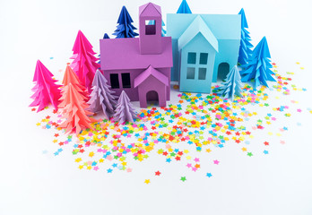 Obraz premium Advent calendar for baby color bright. House and Christmas tree paper hack. Party with rainbow confetti.