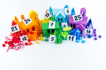 Advent calendar for kids rainbow color. House and Christmas tree paper craft. Copy space