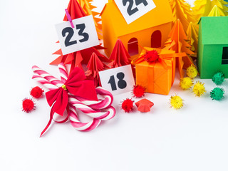 Advent calendar for kids rainbow color. House and Christmas tree paper craft.