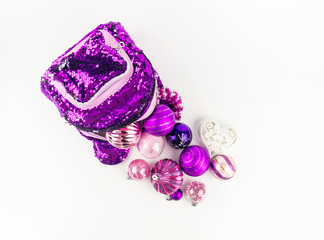 Decorations for the Christmas tree from a backpack on a white background.