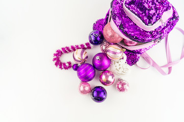 Decorations for the Christmas tree from a backpack on a white background.