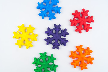 Snowflake foam painted with paint. Colors of rainbow.