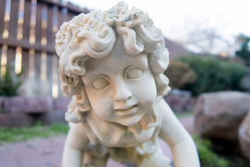cherub statue in the garden