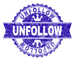 UNFOLLOW rosette seal watermark with grunge style. Designed with round rosette, ribbon and small crowns. Blue vector rubber watermark of UNFOLLOW caption with scratched style.