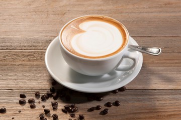 cup of coffee on wooden table