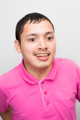 Young handsome disable man smiling on white background