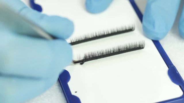 Beauty and fashion concept - close-up tools for eyelash extension procedures