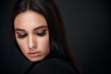 Eyelashes Makeup. Woman Beauty Face With Black Lashes Extensions