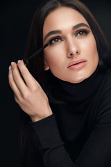 Makeup Cosmetics. Woman With Beauty Face Applying Black Mascara